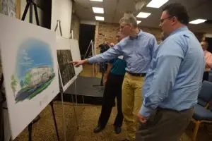 State Board of Missions trustees (from front right) Carl Williams, John Nicholson and Tim Cox take a closer look at plans for the proposed Great Commission Ministries Resource Center in Prattville. 